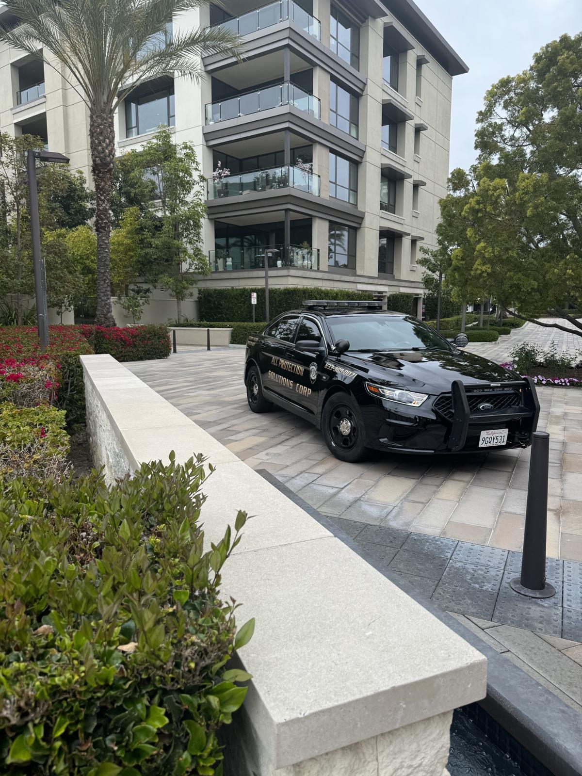 Real APS Security marked patrol car on duty at a Newport Beach property